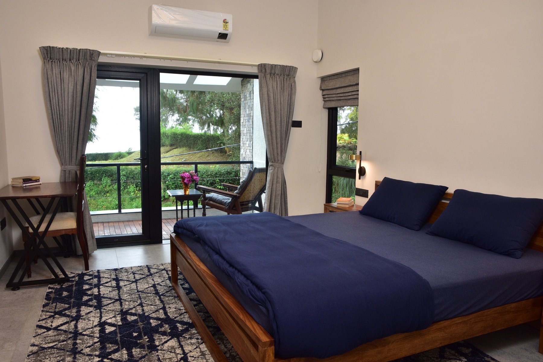 Navy bedroom with balcony
